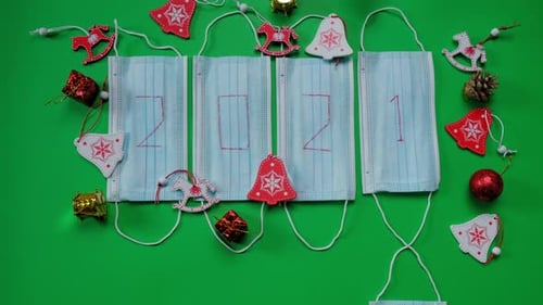 Christmas 2021 Face Mask Ornament on Green Background