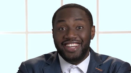 Smiling Man in Suit Looking at Camera