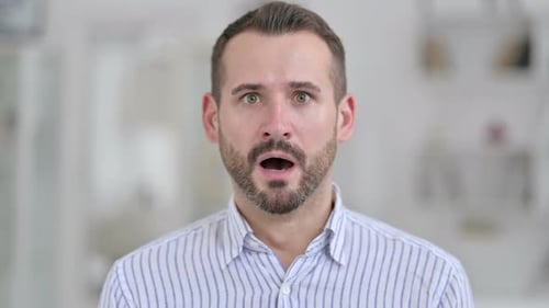 Man Reacts With Shock, Surprised Expression