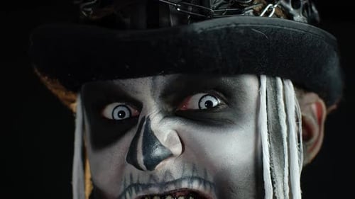 Intense Man with Skeleton Face Paint Screaming