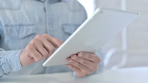 Close Up of Young Guy Hands Typing Document on Tablet