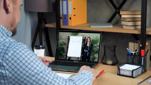 Man at Home Office Study Tells Teacher Online Video Call Chat Webcam Laptop
