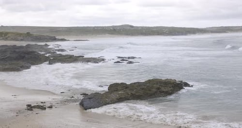 Cornwall seaside view with waves and cliffs