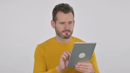 Portrait of Middle Aged Man Celebrating on Tablet in Office