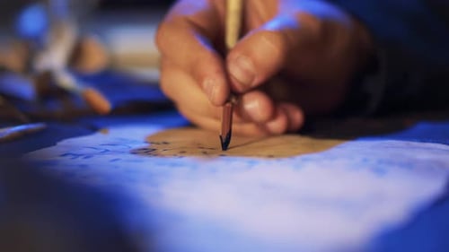 Hand Writes on Parchment Paper with Quill Pen