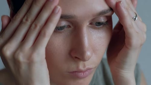 Woman Massaging Face for Skincare and Beauty