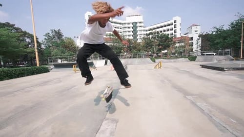 Young Adult Skateboarding in Urban Skate Park
