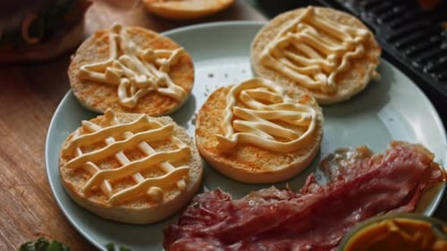 Preparing Burger Buns with Bacon and Mayonnaise