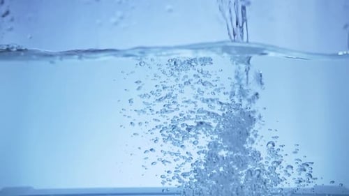 Pour Water Into the Aquarium in Slow Motion Background and Bubbles