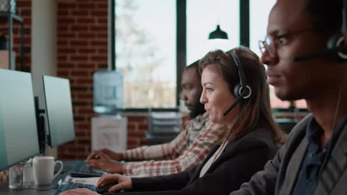 Group of People Answering Helpline Calls at Customer Support Service