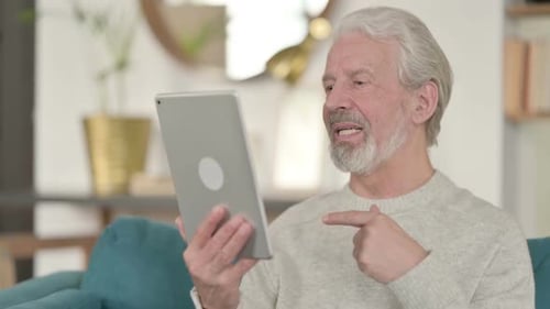 Senior Man Chatting on Tablet Video Call
