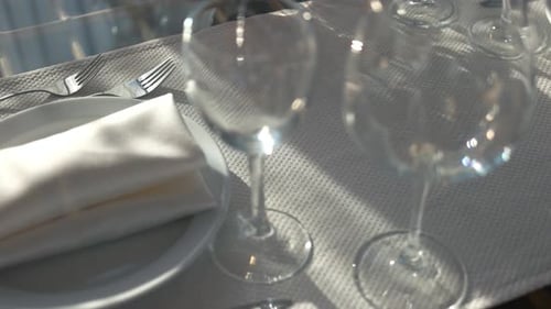 Elegant Restaurant Table Setting with Sunlight