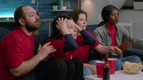 Friends Watching Sports Game on TV at Home