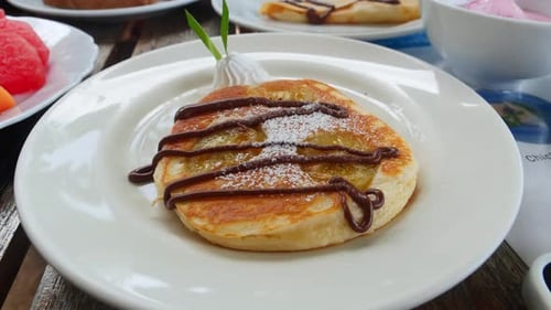 Delicious Pancake with Chocolate and Icing Sugar