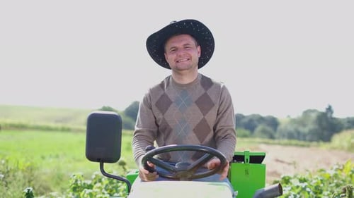 Smiling Man on Tractor in Rural Setting