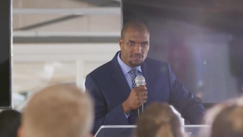 Man Speaks at Corporate Conference Event