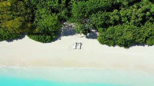 Wide angle drone abstract shot of a paradise sunny white sand beach and aqua turquoise