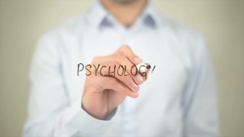 Writing Psychology on Clear Surface
