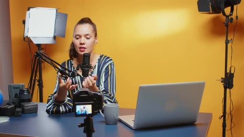 Young Woman Vlogging About Technology in Studio