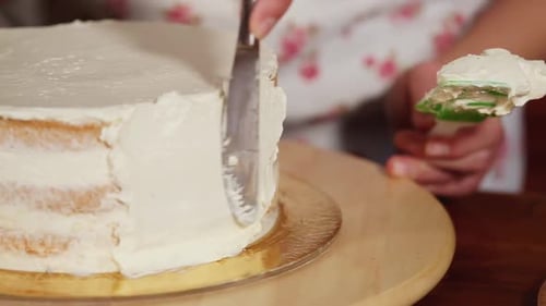 Icing Cake With a Spatula and Knife