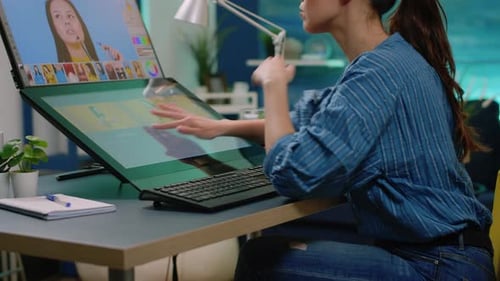 Woman Designs on Computer in her Home Office