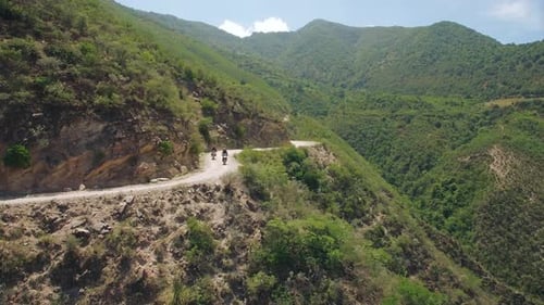 Aerial Of Motorcycle Riders Riding Motorbike On Mountain Roads