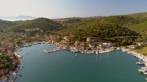 Aerial view above of harbor on the coast of mediterranean sea, Greece.