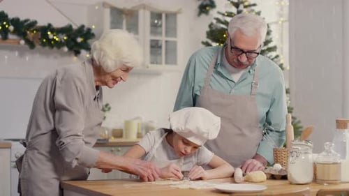 Family Baking Christmas Cookies in a Kitchen
