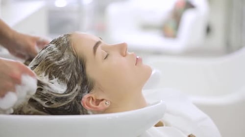 Woman Having Hair Washed in Beauty Salon
