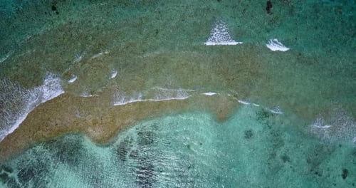 Beautiful drone tourism shot of a white sand paradise beach and blue water background in colourful
