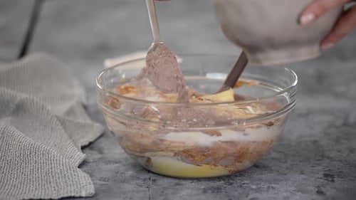 Mixing Batter Ingredients in Bowl with Spatula