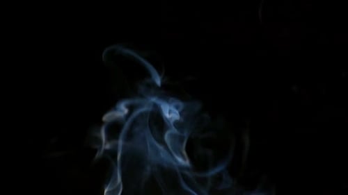 Ethereal Smoke Rising Against Black Background