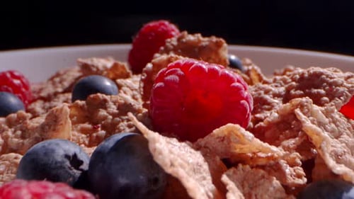 Breakfast Cereal with Berries in a White Bowl