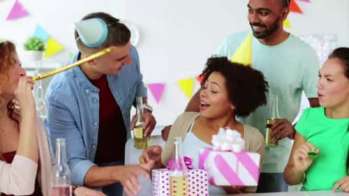 Team Greeting Colleague at Office Birthday Party