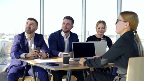 Professional friendly business discussion. Happy business people enjoying working together at office