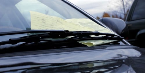 Parking Ticket Under Windshield Wiper on Car