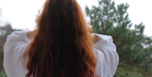 Woman with Long Auburn Hair Outdoors