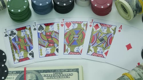 Poker Hand with Chips and Dollar Bills