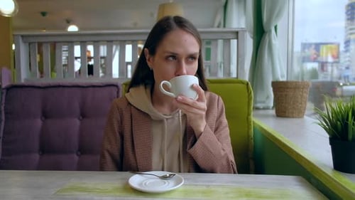 Female Drink Coffee in Cafe