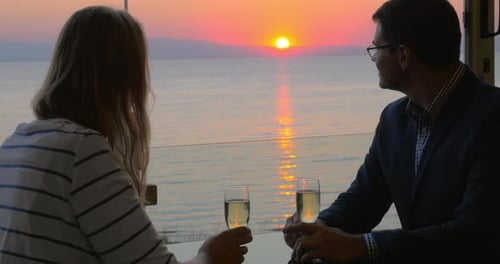 Couple on romantic date at seaside cafe