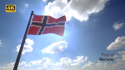 Norwegian Flag Waving in Sunlight Against Blue Sky