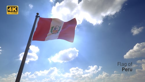 Peru Flag Waving Against Bright Sun and Blue Sky
