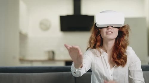 Woman Experiencing Virtual Reality in Her Home