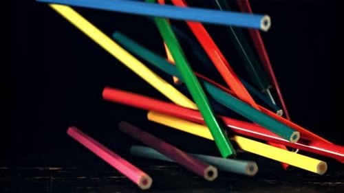 A Pile of Colored Pencils Falls on the Table