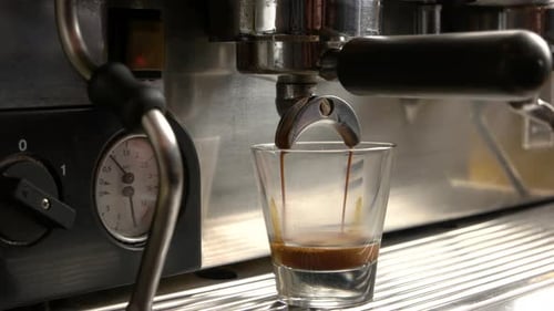 Espresso Machine Fills Glass with Coffee