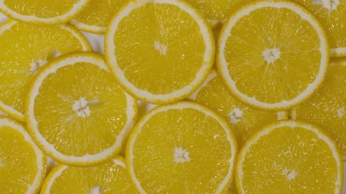 Fresh Orange Slices Rotating in Macro Close Up