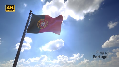 Flag of Portugal Waving with Sun Flares in Blue Sky