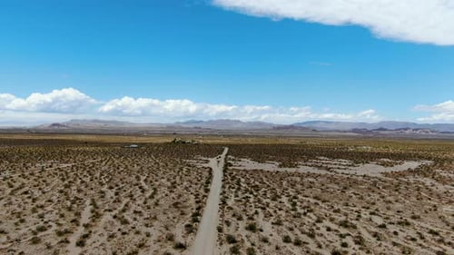 Aerial View of Endless Desert Straight Dust Off Road in Joshua Tree Park. USA