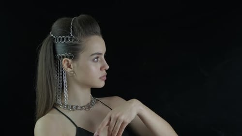 Stylish Woman Posing with Silver Chain Jewelry