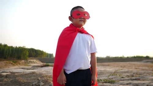 superhero boy running on the field